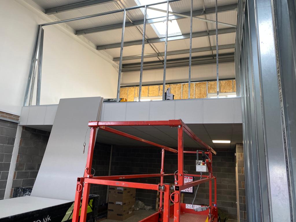 View of mezzanine framework from warehouse below