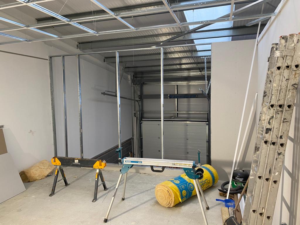 The first phase of constructing a mezzanine office, in a warehouse